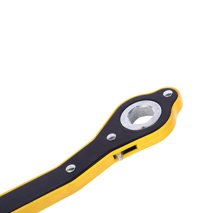 Yellow and black ratchet wrench on a white background